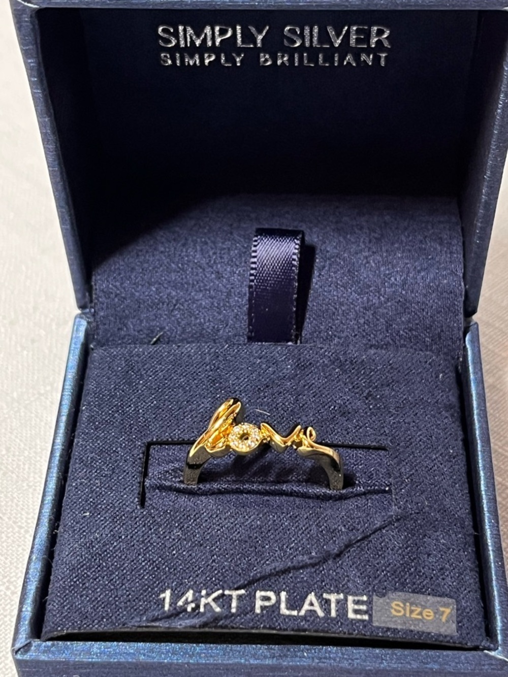 14KT Plate Gold 'Love' Script Ring 
Size 7. Box included. Perfect gift.